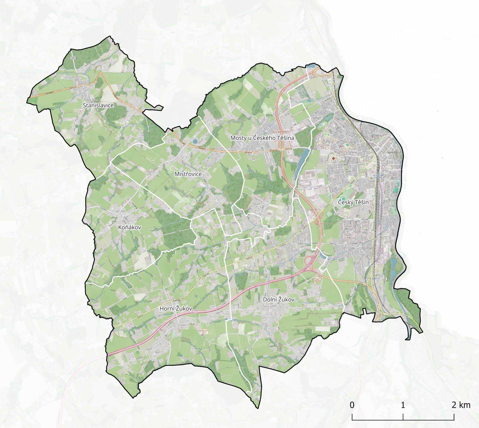 Mapa území města Český Těšín a jeho místních částí, jako jsou Stanislavice, Mistřovice, Koňákov, Horní a Dolní Žukov. Mapa zobrazuje hranice území, hlavní silnice, zelené plochy a zástavbu. Neobsahuje tematická data, slouží jako podkladová orientační mapa.